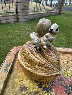 The product is a vintage Armbee ceramic squirrel on a walnut candy or nut dish