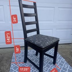 Wooden armchair with cushions