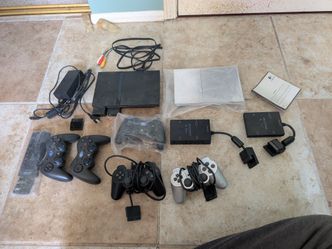 PS2 SLIM COMPLETE WITH GAMES AND CABLES