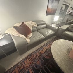Two leather couches and a leather chair