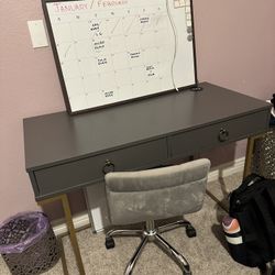 Small Dark Grey Desk With Gold Legs And Light Grey Velvet Swivel Office Chair 