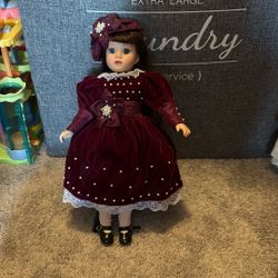 maroon dress porcelain doll