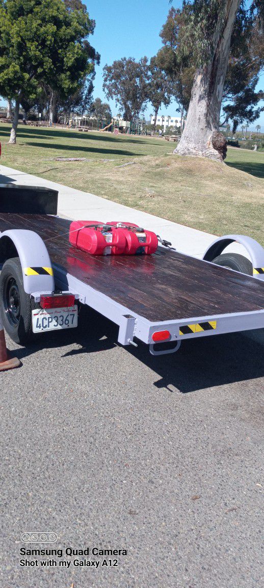 Used Flat Bed Trailer.about 16ftlong X5 Wide. Current  Registration.  Wit Toombox  Ready For Any Proyect.single Axle 