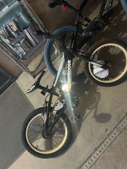 Mongoose green and black and the size is around 12 to 16 inch wheel