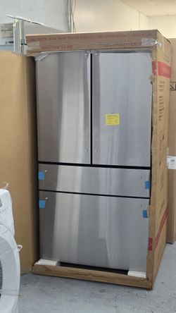 Brand new GE Cafe 4 door refrigerator with water dispenser inside 