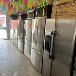 Kitchen package stainless steel refrigerator stove dishwasher and microwave great condition working perfect tasted With Warranty delivery and installa