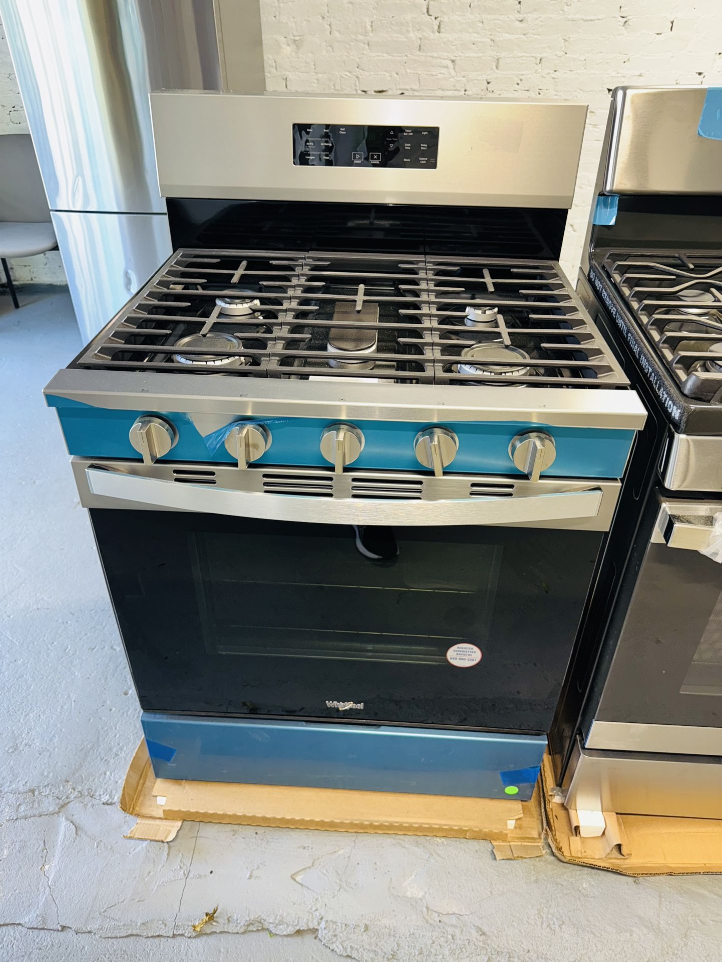 New Whirlpool gas stove, a one-year warranty receipt from the company