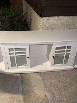 Free. White Wood TV Stand with Glass Door Cabinets
