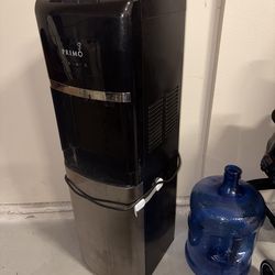 Primo bottom-loading water dispenser in good working condition.