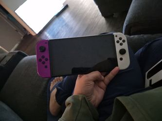 Nintendo Switch with Purple and White Joy-Cons
