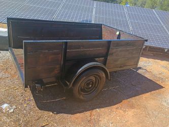 Trailer great condition stained wood panelings new tires good planks on the slats all good matte black paint on the under carriage and all the frame e