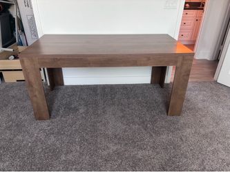 31” wide by 63” long and 30” high engineered wood desk/table