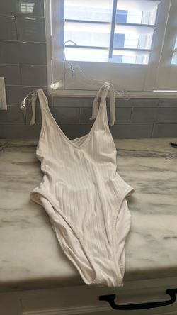 New white ribbed bodysuit one piece.