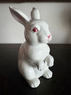 vintage white ceramic or porcelain bunny rabbit figurine with pink-and-red eyes and a pink nose