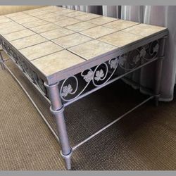 Decorative metal frame tiled coffee table with removable tiles.