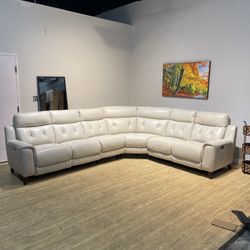 Cream leather sectional recliner couch