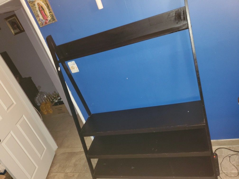 Used black wood tv stand. Must pick up