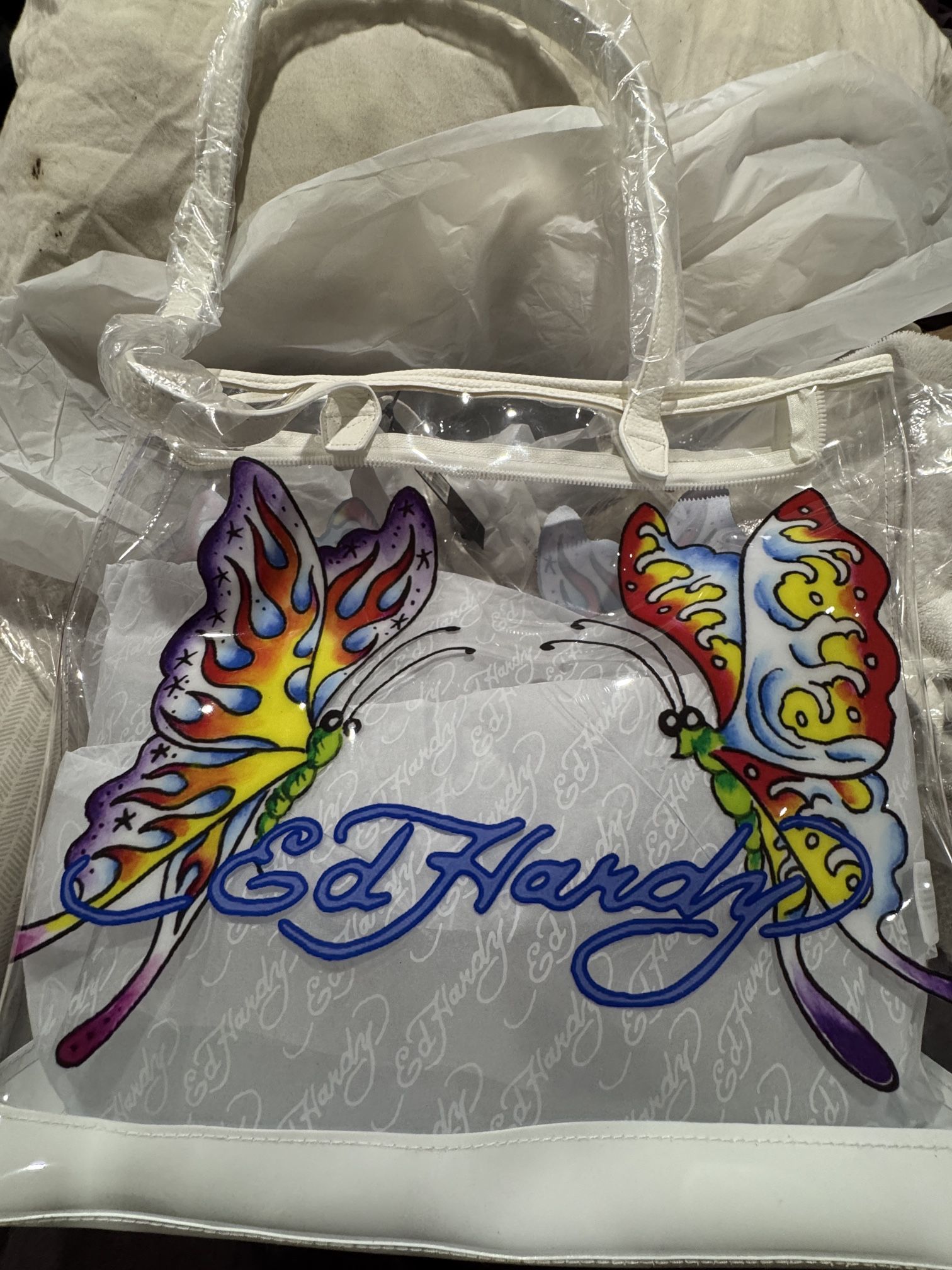 This is an Ed Hardy clear PVC tote bag.