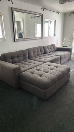 Large Gray Tufted Sectional Sofa with Ottoman