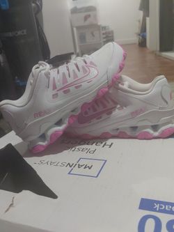 White and pink nike's
