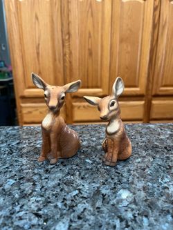 Vintage Deer Pair of Salt and Pepper Shakers.  Size the tallest is 4 1/4 inches tall.  Preowned never used.  Has been on display in a cabinet with a v
