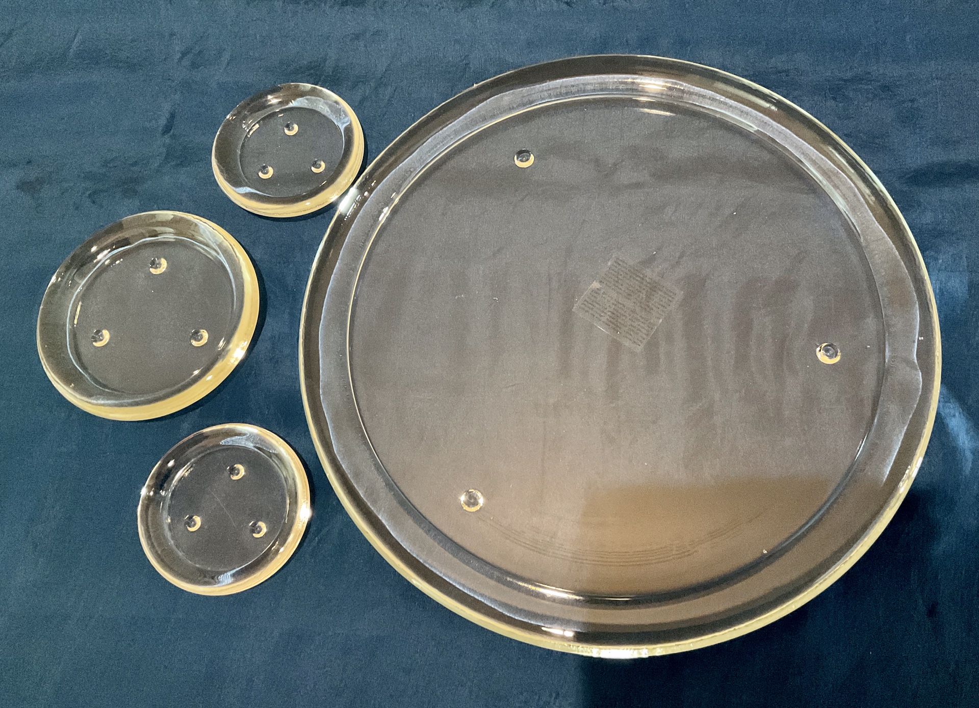 Four Round Rimmed Glass Candle Plates