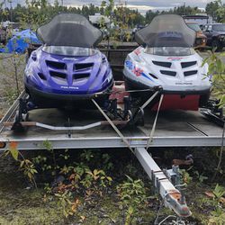 Two old sleds on trailer