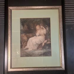 framed print depicting a scene from literature, specifically "Una and the Lion" from Edmund Spenser's The Faerie Queene.