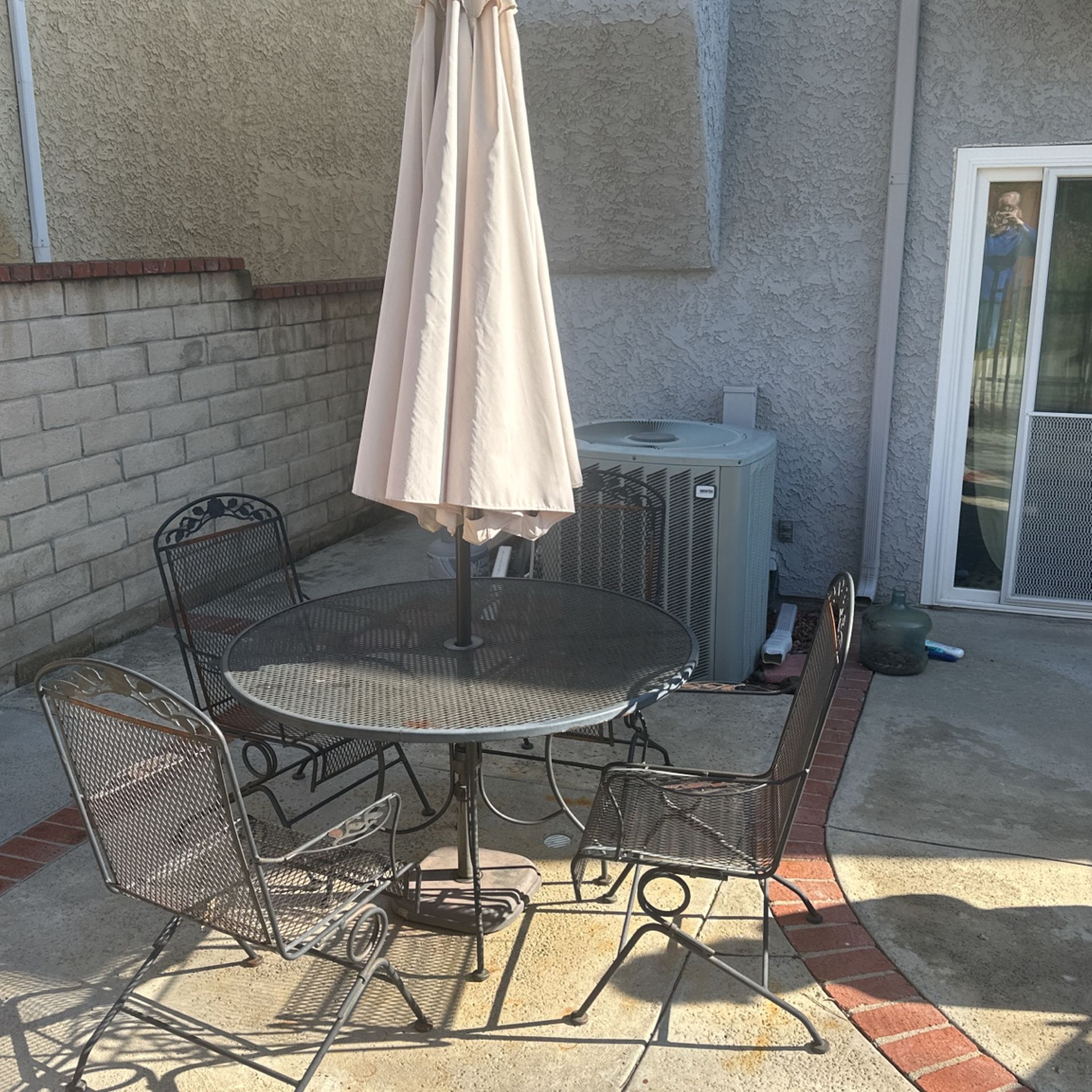 Rot-iron Table, 4 Chairs, and Umbrella