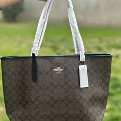 Coach City tote bags in classic signature print.