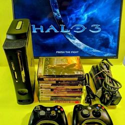 Microsoft Xbox 360 slim with 2 controllers 12 games power supply 