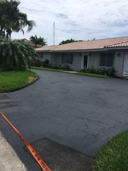 Asphalt Sealcoating extra material $200 worth of sealer