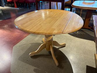 Blonde Oak Round Solid Wood Pedestal Table with Drop Leaves