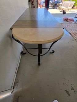 Travertine table top with base.