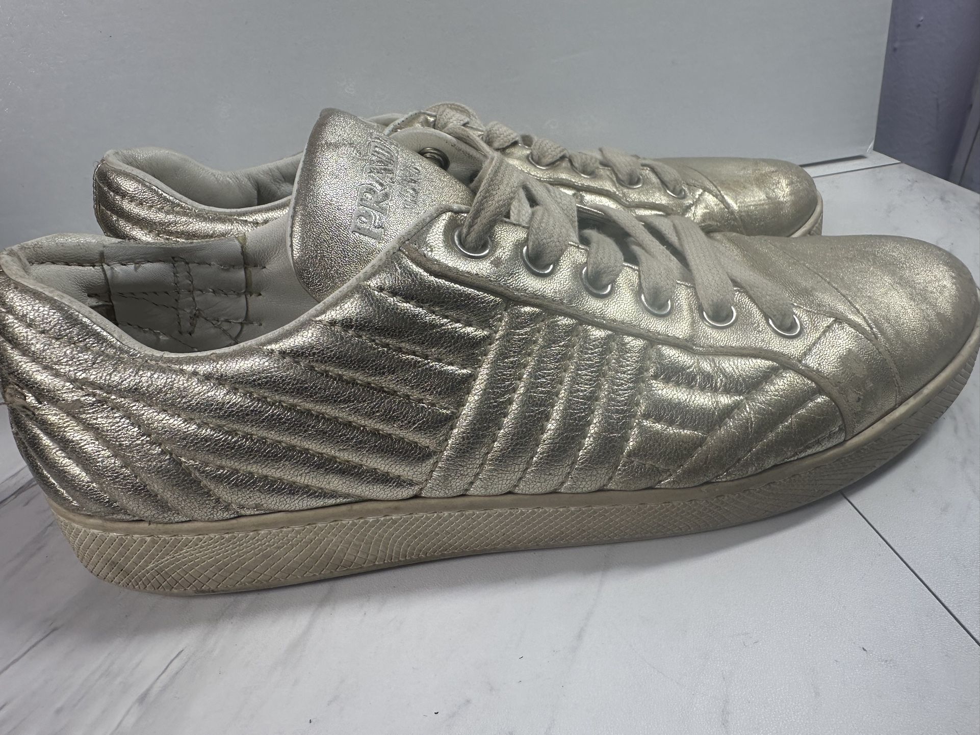 Prada Diagramme Quilted Low Top Sneakers Gold Metallic Leather