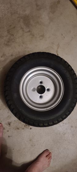 Two 20x12.00-10 tractor wheels with Antego turf tires