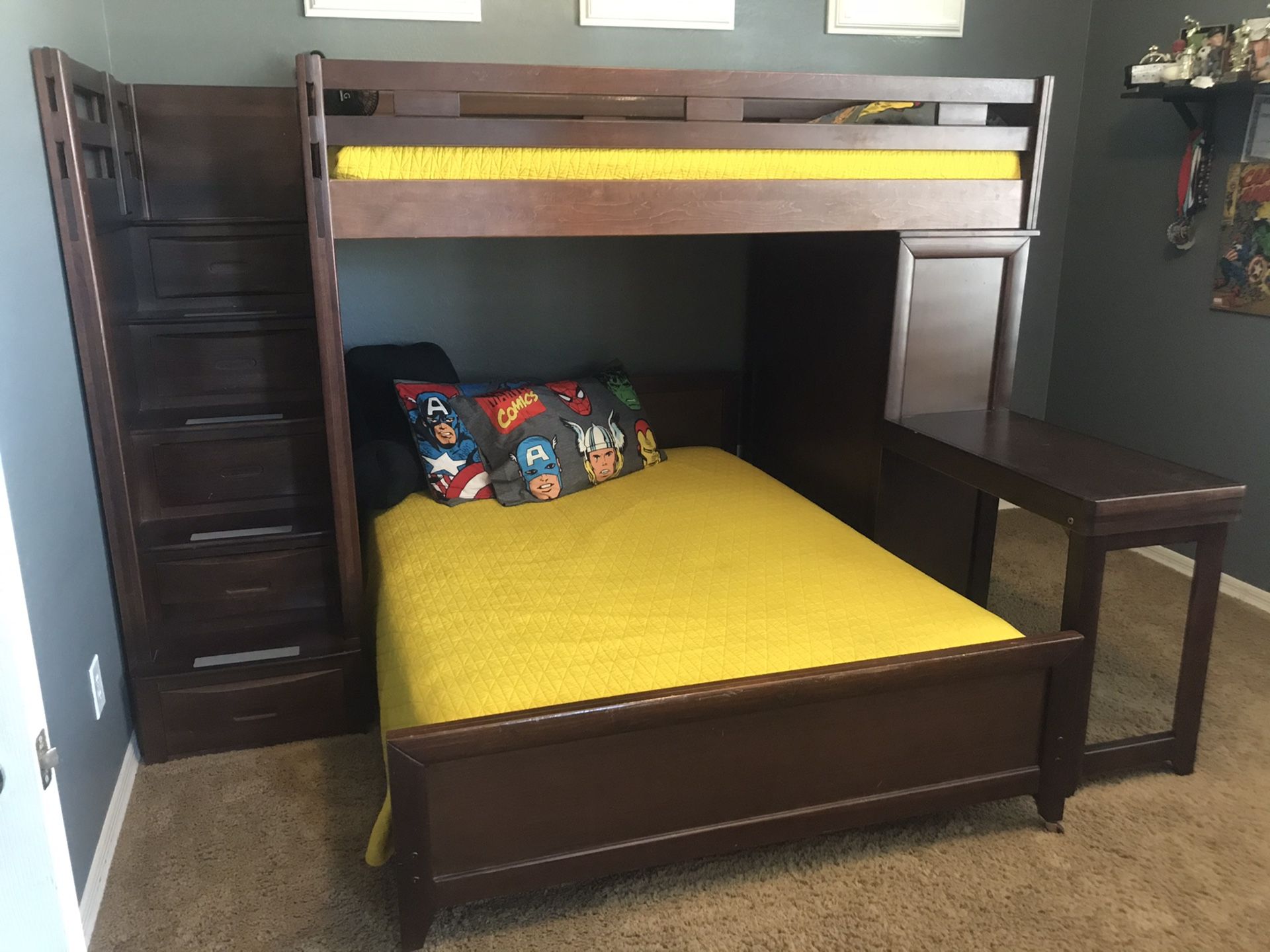 Bunk bed with bed that pulls out, desk and armoire.