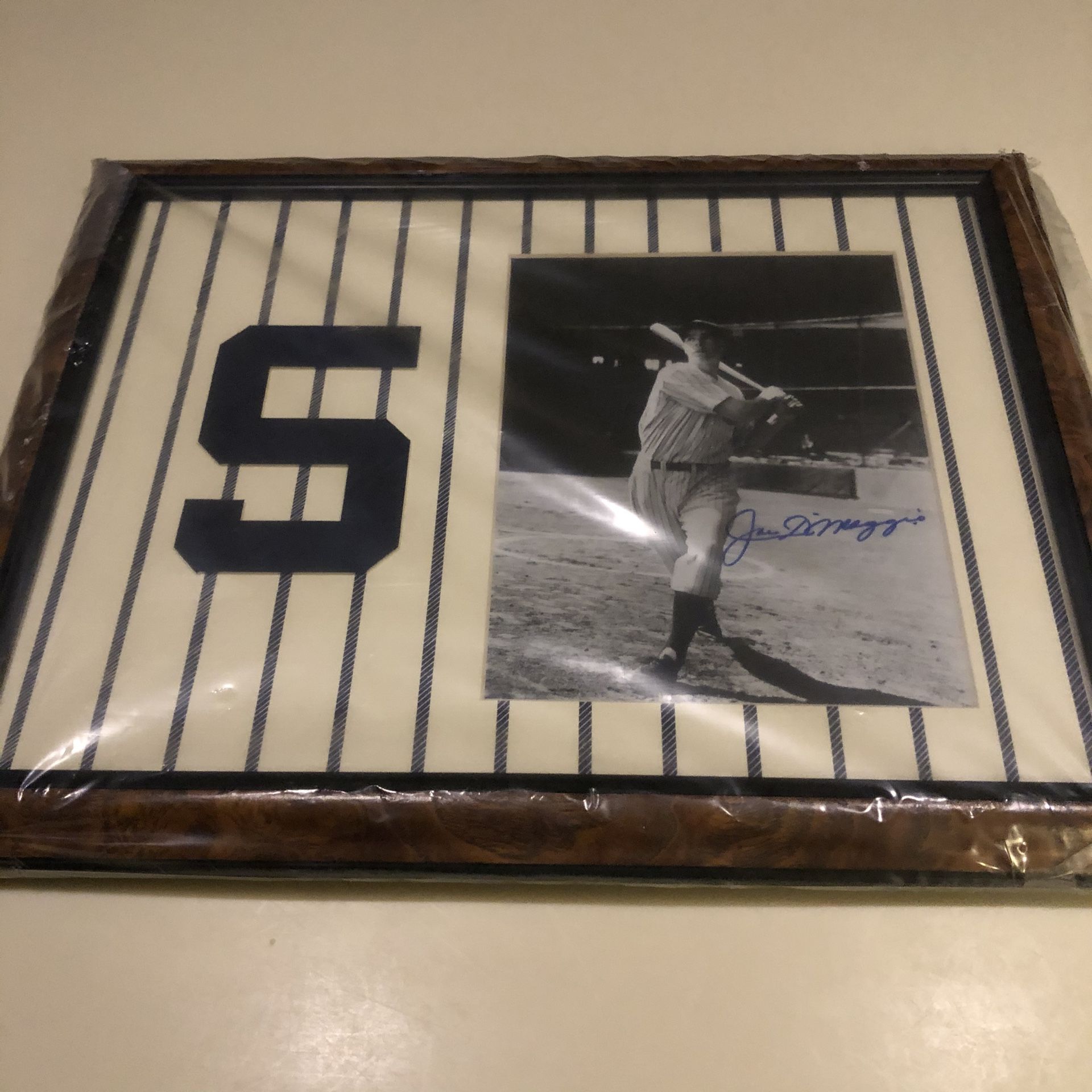 Joe DiMaggio autographed picture.