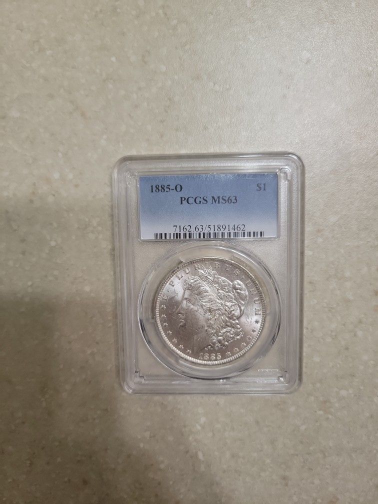1885 O Morgan Silver Dollar. Graded