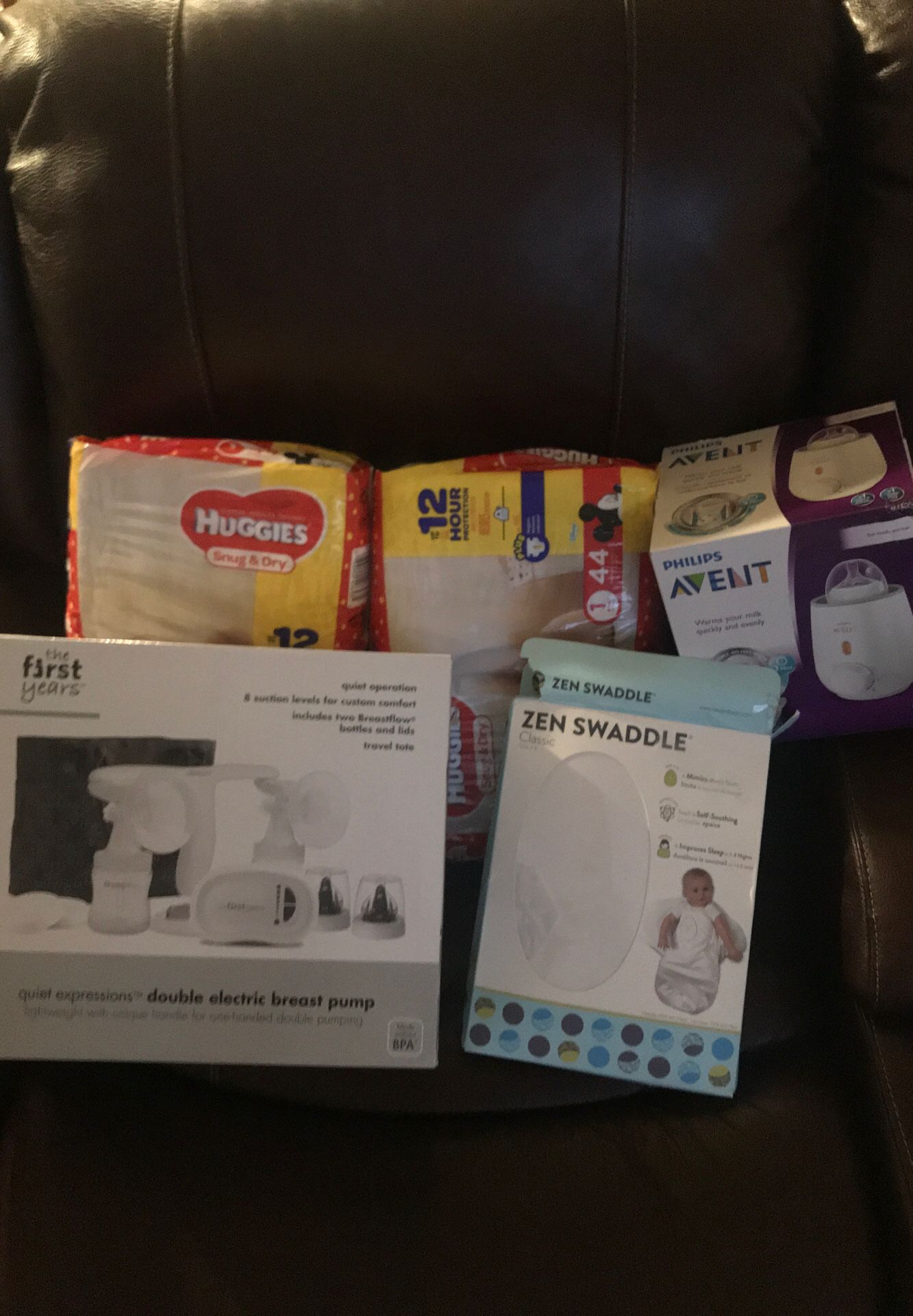 Breast pump , Bottle Warmer, 2 pack of Huggies, and a Swaddle all sold togeather!!!!!