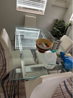 Dinning room table has six chairs and opens longer