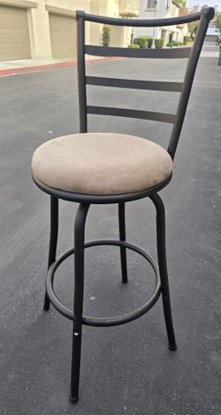 Swivel seat cocktail or barstool height high back chairs.