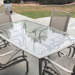 Glass Table and Four Chairs
