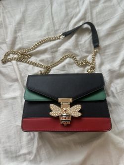BLACK, RED AND GREEN BAG.