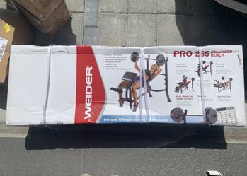 Brand new weider pro 265 weight bench with bar and 80lbs of plates