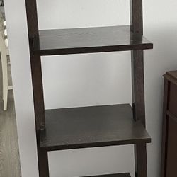 Tiered brown stand alone ladder shelf