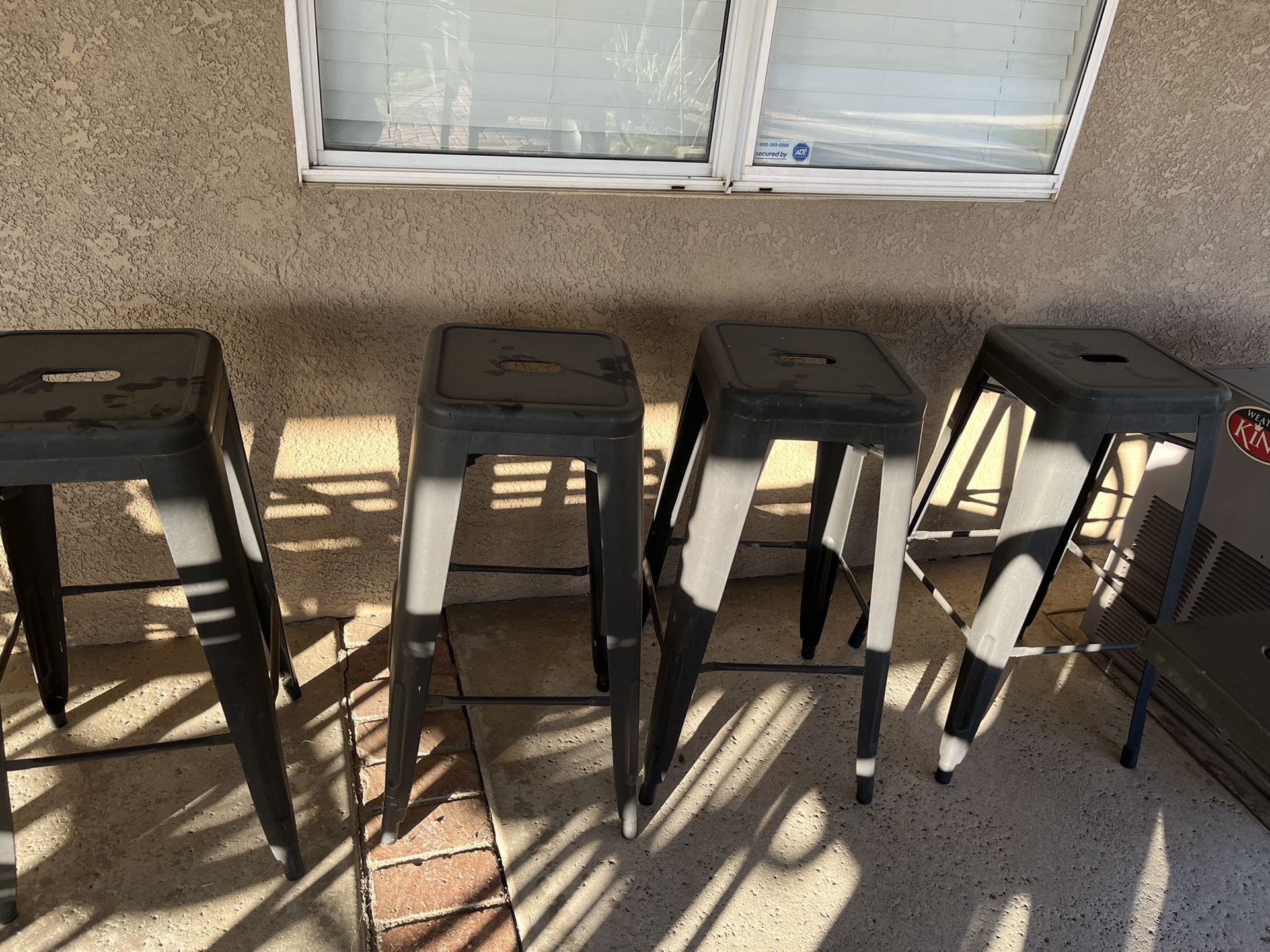 Four Black Stainless Steel Bar Stools