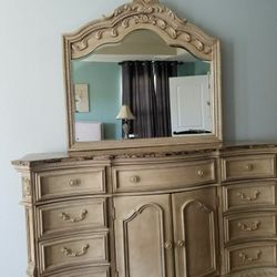 Ashley furniture Marble top Dresser with mirror, 2 matching nightstands and a dresser