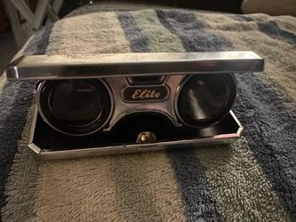 These are vintage Elite folding opera binoculars