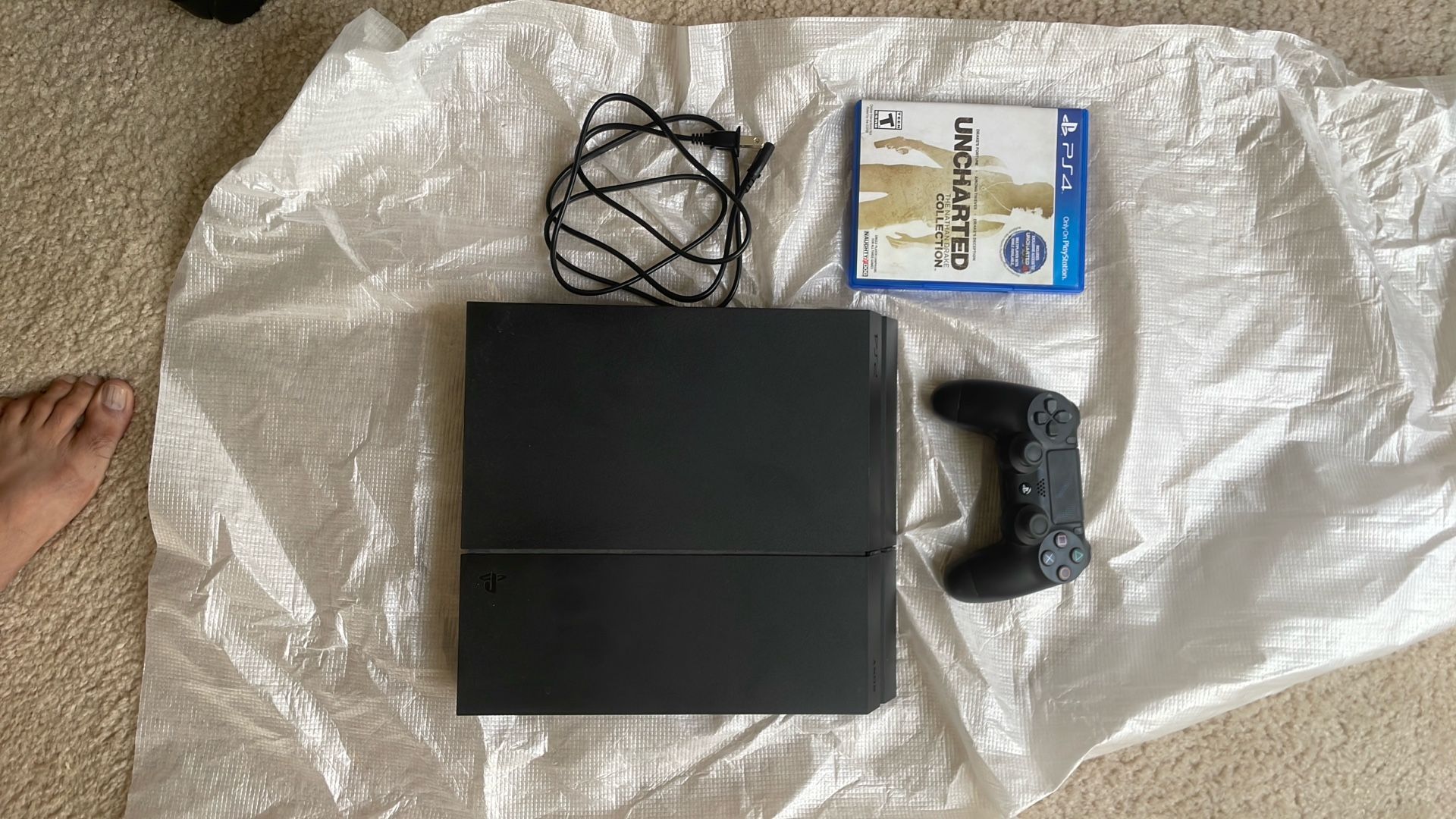 Used PS4 with Uncharted (Good Condition)